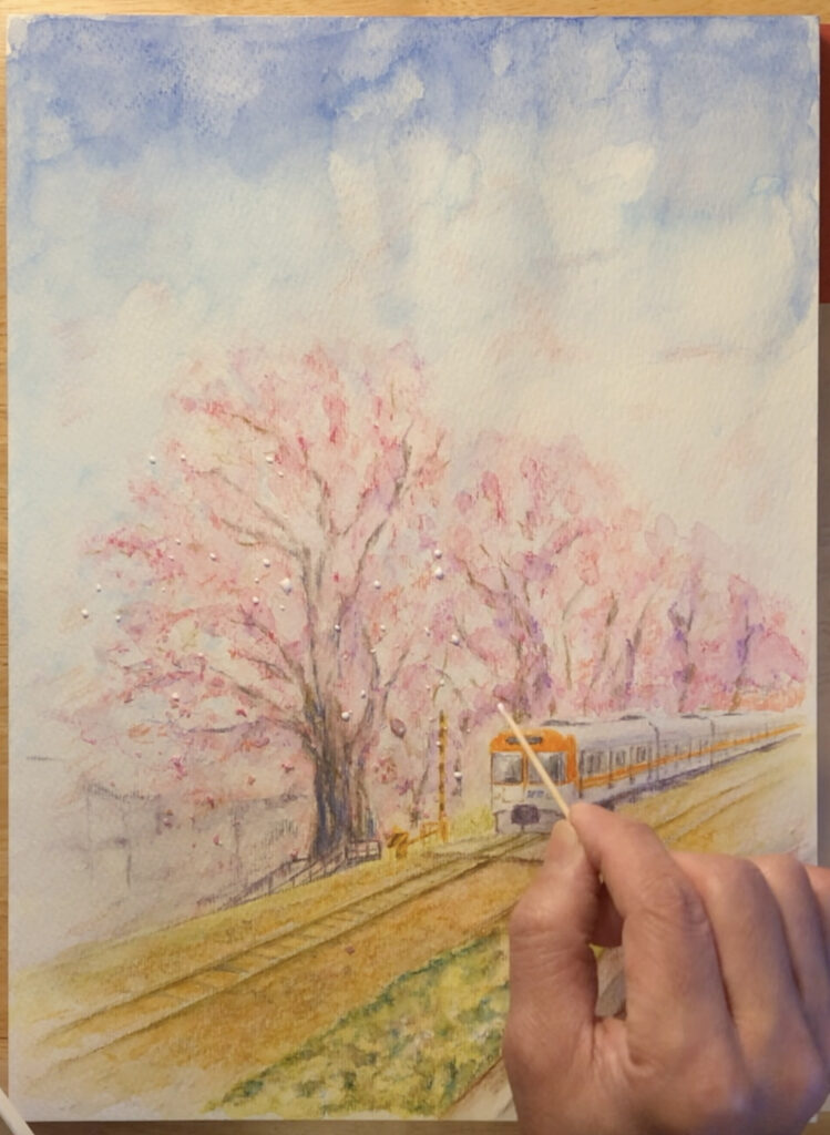 桜の下を走る列車の絵の制作