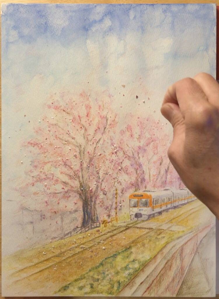 桜の下を走る列車の絵の制作