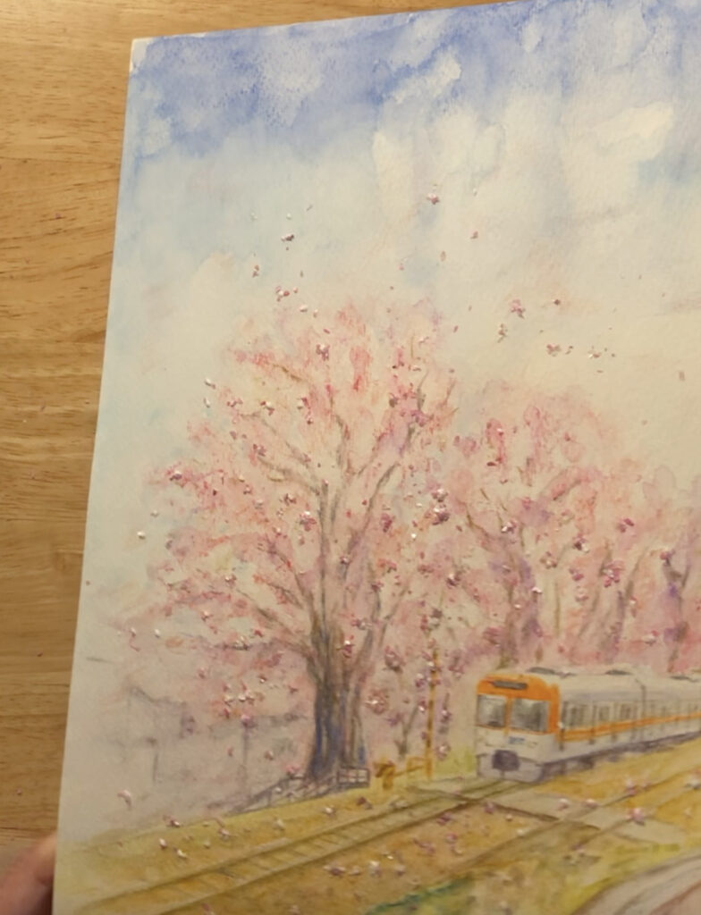 桜の下を走る列車の絵の制作